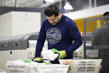 Los Angeles County election workers seen processing ballots at the Los Angeles County Ballot Processing Center. Ballot counting in California typically continues for several days after Election Day, as mail ballots remain eligible if they are postmarked by Election Day and received within seven days of the election.