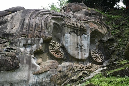 The Godess in the hills of Unokoti seen carved in the rock, hosts an ancient Shaivite place of worship with huge rock reliefs celebrating Shiva.
It is the prime tourist spot of Unakoti District Tripura in the Kailashahar Subdivision in the North-eastern Indian state of Tripura. It is Shiva pilgrimage and dates back to 7th – 9th centuries if not earlier.