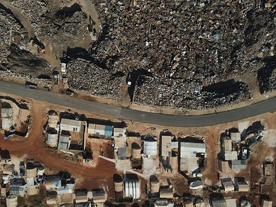 (EDITOR'S NOTE : Image taken with drone) A scrapyard is seen near the tents of a IDP (internal displaced people) camp in north of Idlib.
