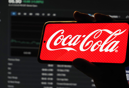 In this photo illustration, the Coca-Cola Company logo is displayed on a smartphone screen.