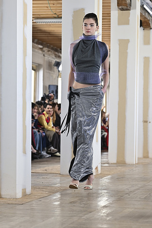 A model walks the runway wearing a design by Ernesto Naranjo during Mercedes-Benz Fashion Week de Madrid at Palacio Fernaz Nuñoz.