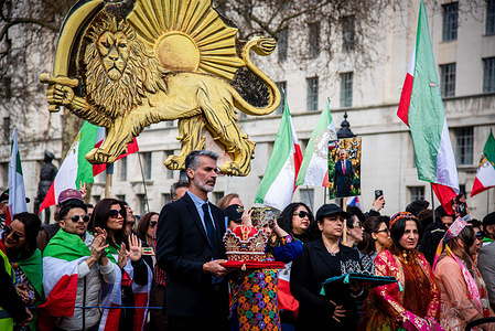 Protestors hold crowns during the Pro-Iran Regime Change Rally at Whitehall. Protesters gathered calling for regime change in Iran, with some expressing support for Crown Prince Reza Pahlavi as a potential transitional figure. Demonstrators rallied and marched, reflecting growing opposition to the current government.