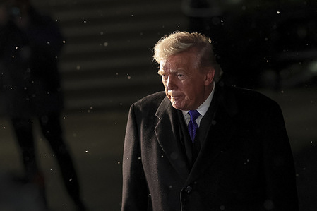 U.S. President Donald Trump speaks with reporters on the South Lawn of the White House before departing for a weekend trip to Palm Beach, Florida.