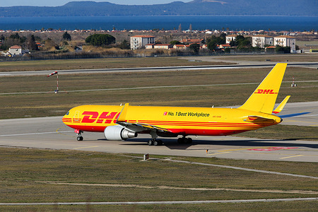 A DHL Airlines Boeing 767-323 seen leaving Marseille Provence airport. This airliner converted into a cargo plane can carry up to 50 tons of load authorized by the structure for an approximate range of 3000 miles (4828 kilometers).