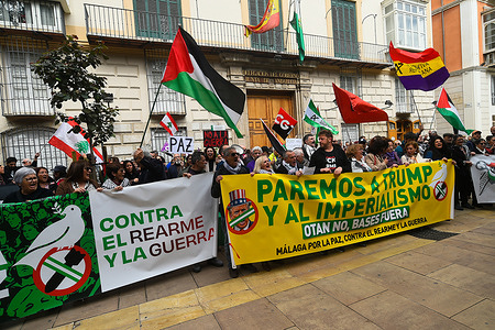 Demonstrators are seen holding large banners against the war as they take part in a protest. Dozens of people under the slogan “Stop Trump and imperialism” have taken part in a protest against the war between the United States and Iran and in favour of peace. The war between the United States and Iran has caused the deaths of more than a thousand people since the start of the war.
