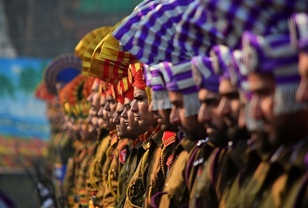 A contingent of Indian policemen stand in formation at the Sher-e-Kashmir stadium, where the authorities hold the main function during India's Republic Day celebrations in Srinagar, Indian administered Kashmir.The local government in Indian administered Kashmir on Friday organized official functions to mark India's 69th Republic Day amid stepped up security vigil and shutdown called by separatist groups, officials said. Two major functions were held in twin capital cities of the region-Srinagar and Jammu, where the contingents of police, paramilitary troopers, young cadets and school children marched past the Indian flag and staged performances to mark official celebrations.