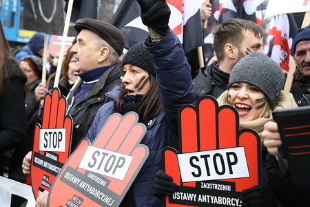 Protesters seen holding placards during the demonstration.
Thousands of protesters took to the street in Warsaw during "Black Friday" protest against plans to further restrict abortion in Poland.