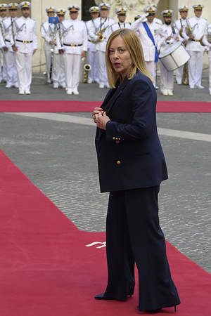 Prime Minister of Italy Giorgia Meloni waiting to meet the President of the French Republic Emmanuel Macron ( not in view ) at Palazzo Chigi.