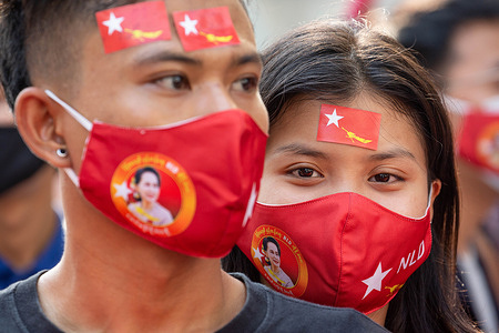 Demonstrators wearing NLD facemasks during a protest outside the Embassy of Myanmar in Bangkok. Burmese demonstrators gathered in front of the Myanmar Embassy in Bangkok on the day Myanmar's military detained State Counsellor of Myanmar Aung San Suu Kyi and declared a state of emergency while seizing the power in the country for a year after losing the election against the National League for Democracy (NLD).