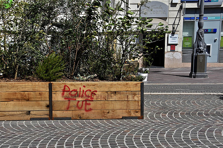 A message "Police kill" spray painted on a wooden planter by rioters in Marseille. After four consecutive nights of riots, many stores and building suffered considerable damage in Marseille and many other French cities. Police arrested 1,311 people nationwide. The unrest was sparked by the death of Nahel, a 17-year-old who was shot by police during a traffic stop in Parisian suburb of Nanterre on June 27, 2023.
