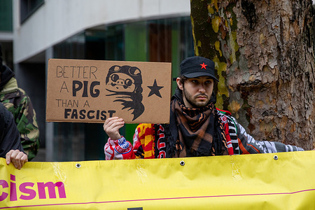 A Stand up to Racism activist holds a placard during an Advance UK conference in London. The newly formed political party Advance UK held a sold-out meeting in London addressing British culture and immigration. The event, at the Emanuel Centre in Westminster, set out proposals for tougher immigration controls and stronger community integration through the promotion of British culture. A small protest took place outside the venue by the left-wing group Stand Up to Racism, which describes the party’s policies as divisive.