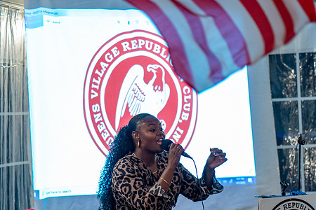 Evangelist Bevelyn Beatty (she was arrested weeks earlier for defacing a BLM mural in front of Trump Tower) gives an impassioned speech during a Steve Bannon speaking engagement with Queens Village Republican Club in Triple Crown Diner, Middle Village, Queens.