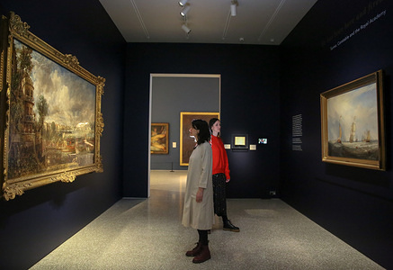 Staff members seen viewing paintings by John Constable and J.M.W Turner.
The Royal Academy Schools’ most illustrious graduates, exhibits Helvoetsluys (Helvoetsluys; - the City of Utrecht, 64, going to sea) 1832 by J.M.W. Turner (1775-1851) and The opening of Waterloo Bridge (ÒWaterloo Bridge, from the Whitehall Stairs, 18th June 1817) by John Constable (1776-1837), in, are-telling of one of the most legendary events in the history of the Summer Exhibition, it toke place at the Royal Academy of Arts. The two paintings were reunited for the first time since the artists clashed at the Summer Exhibition in 1832.