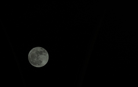 A "full moon," also known as a "little blue moon," rises in the skies of Doha. This is a rare phenomenon that occurs every two to three years coinciding with a micro-moon.