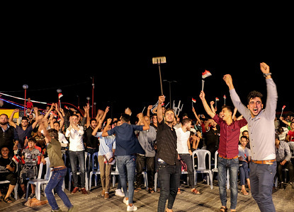 Palestinian fans cheer on the goal of the Egyptian team at the World Cup in the Gaza port.
Palestinians watch on a big screen the Russia 2018 World Cup Group A football match between Russia and Egypt at seaport in Gaza city. Russia won 3-1.