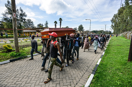A group of waste pickers march with an empty casket demanding the body of their colleague who died in a dumpsite fire be released to them for burial. The body has been laying at the Nakuru Level 5 hospital mortuary since February. The group said they could not afford the exorbitant accrued mortuary fees.