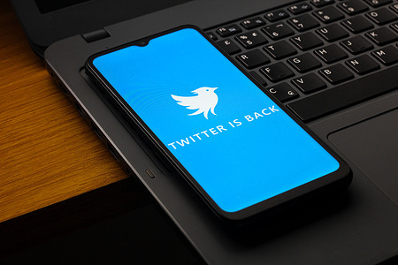 In this photo illustration, the Twitter.now (Twitter Now) logo is seen displayed on a smartphone screen.