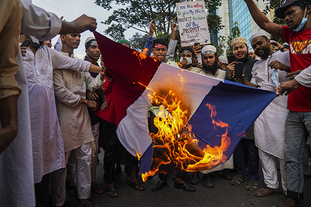 Protesters from an Islamist political party, burn a French flag during the demonstration.
Protest calling for the boycott of French products and denouncing Macron for his comments over Prophet Mohammed caricatures.