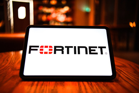 In this photo illustration, the Fortinet logo is displayed on the screen of a smart tablet.