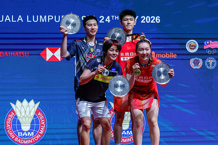 Gao Jia Xuan (R1) of china, Wei Ya Xin (R2) of China , Pakkapon Teeraratsakul (L1) of Thailand and Sapsiree Taerattanachai (L2) of Thailand seen posing with their medals on the podium during the medal ceremony after the Mixed Doubles Final match during Perodua Malaysia Masters 2026 at Unifi Arena. Gao Jia Xuan and Wei Ya Xin won with scores; 21/15/21 : 13/21/11