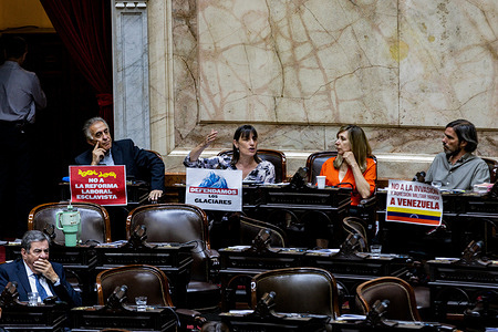 Deputy Romina del Plá of the Workers' Party (PO) participates in a session of the Chamber of Deputies. On her desk, a sign reads 'Defendamos los Glaciares' (Let's defend the glaciers), expressing opposition to the reform of the Glacier Protection Law. The legislative branch called for the first debate of the extraordinary sessions in the Chamber of Deputies. The government sent a package of bills to the National Congress to be approved before the end of the month, including labor reform. The opposition seeks to introduce changes or postpone the decisions until next year.