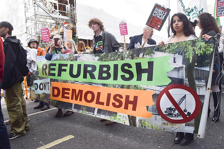 Protesters march with a 'Refurbish, don't demolish' banner in Oxford Street during the National Housing Demonstration, demanding rent controls and council homes.
