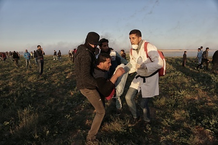 Medical workers seen carrying an injured Palestinian during the clashes.
Palestinians Clashed with Israeli troops during protests on the Gaza-Israel wall east of Khan Yunis.