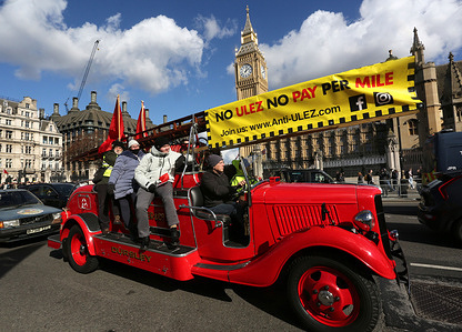 The owner of a vintage fire engine arrives in Parliament Square with a banner saying ’No ULEZ No Pay Per Mile’ on show during the demonstration. A number of vehicles ran in a convoy from Streatham to Parliament Square to highlight their dissatisfaction at the increasing use of 20 mph zones, low traffic neighbourhoods and the ultra low emission zones. They call for these restrictive measures to be dropped.