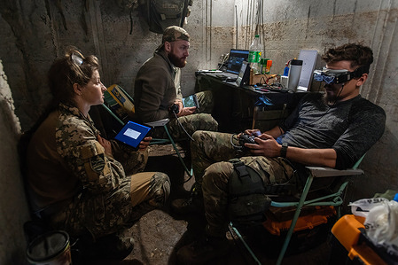 An FPV drone unit from the 92nd Brigade, known as "Achilles", operates inside a bunker about 10 kilometers from the Russian border in Kharkiv Oblast, Ukraine. First Person View (FPV) drones have changed the nature of warfare in Ukraine, with both Ukrainian and Russian forces coming to rely on these drones, which are armed with explosives and remotely controlled by a pilot wearing a headset.