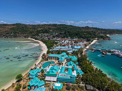 An aerial view of resorts sitting on Loh Dalum Bay. Phi Phi Islands are a group of limestone islands in southern Thailand, located in the Andaman Sea between Phuket and Krabi. Known for their dramatic karst hills, turquoise sea, white-sand beaches, and vibrant marine life, Phi Phi is one of Thailand’s most iconic tourist destinations. The islands are accessible only by boat, and tourism here revolves around snorkeling, diving, island-hopping, scenic viewpoints, and coastal village life, especially around Phi Phi Don, the only inhabited island.