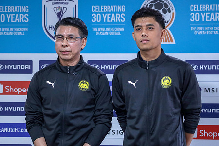 Malaysia head coach Tan Cheng Hoe (L) and player representative Syafiq Ahmad pose for photos after the pre-match press conference for the ASEAN Hyundai Cup 2026 match between Malaysia and Laos at Kuala Lumpur Football Stadium, Cheras.