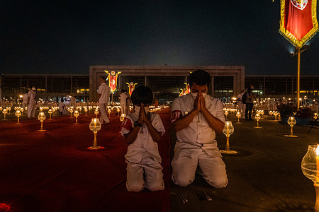 Devotees seen praying during the meditation ceremony for Makha Bucha Day at Wat Dhammakaya temple.
Devotees in person and worldwide marked the temple's 52nd anniversary by lighting 1 million lanterns and planting 1 million trees.