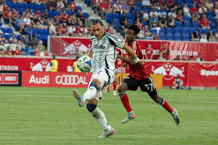 Peyton Miller (25) of New England seen in action during the Football match between New York Red Bulls and New England at Sports Illustrated Stadium. New York Red Bulls 5 - 3 New England