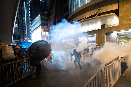 A demonstrator escapes as riot police fire multiple rounds of tear gas canisters against him during the protest.
Tens of thousands of pro-democracy protesters marched in central Hong Kong in yet another round of anti government demonstration. Riot police has used tear gas and rubber bullets against protesters despite the fact that the police force has been widely commended by the public for their disproportionate use of force against the protesters in past demonstrations triggered by the controversial extradition bill put forward by the Hong Kong government.