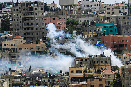 Heavy smoke seen rising from several buildings in Nour Shams Palestinian refugee camp, near Tulkarm in the northern West Bank. Israeli forces stormed Nour Shams refugee camp at dawn, and clashes broke out between Palestinian resistance fighters and the forces, the Israeli forces used a large bulldozer which caused destruction to the camps' infrastructure, and the operation is still continuing. The latest statistics indicate that 12 Palestinians were killed, most of them children, as a drone targeted a group of Palestinians in the camp.