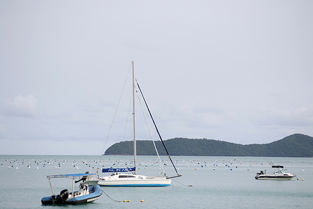 Yachts near Ao Yon Beach on waters of the Andaman Sea in Thailand.