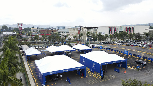 (EDITORS NOTE: Image taken with drone)Aerial view of a drive thru vaccination facility.The Salvadoran government has opened up a drive through vaccination facility to increase daily vaccinations as it closes up on a million COVID-19 vaccine doses applied.
