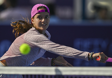 Emiliana Arango of Colombia seen in action with Xinyu Wang of China (Not in view) during the round of 64 match at the WTA Qatar TotalEnergies Open 2026 tennis tournament at the Khalifa International Tennis Complex. Xinyu Wang won against Emiliana Arango 6-1, 7-5.