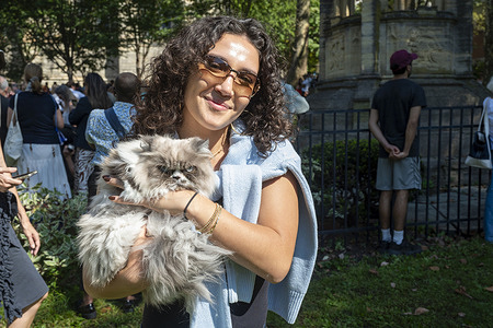 A woman holds a cat at the Blessing of the Animals at the Cathedral of St. John the Divine on October 5, 2025 in New York City. In honor of St. Francis of Assisi, the patron saint of animals and the environment, Christians celebrate by blessing animals and praying.