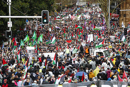 Protesters march towards the Sydney Harbour Bridge during the rally. Thousands of protesters took part in the “March for Humanity Save Gaza,” crossing the Sydney Harbour Bridge to call for an end to Israel’s military assault on Gaza and demand immediate humanitarian aid access. The march was part of a broader movement across Australia condemning the bombardment, displacement, and civilian deaths in the besieged territory. Protesters also raised urgent concerns over the deepening food crisis, with the United Nations warning that more than a million Palestinians in Gaza are facing catastrophic hunger, particularly children suffering from severe malnutrition.