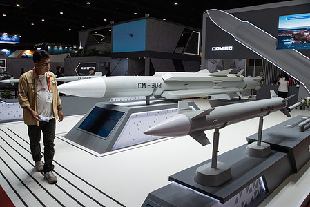 A visitor inspects rockets and missiles during the exhibition. The Defense and Security 2025 was held at the IMPACT Muang Thong Thani, Nonthaburi province, the four-day exhibition that showcases the new military weapons, equipment, technology and products for land, sea and air defense, and internal security.
