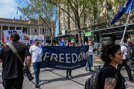 Activists holding large "Freedom" banner during "No to the Voice" rally in Melbourne, Victoria. Hundreds of Victorians gathered in support of the NO vote for the upcoming 2023 Australian Indigenous Voice referendum set to take Australians to the voting polls on 14th of October 2023.