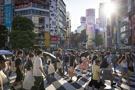 Crowds of people walk over Shibuya crossing during the golden hour. Tokyo, Japan's bustling capital, faces overtourism due to its global popularity as a cultural, culinary, and technological hub. Iconic areas like Shibuya, Shinjuku, and Asakusa see millions of visitors annually, with 31.88 million foreign tourists arriving in Japan in 2024, many concentrating in Tokyo. This surge strains infrastructure, public transport, and local communities, causing overcrowding, rising costs, and environmental concerns. Popular sites like Shibuya Crossing and Senso-ji Temple often become congested, diminishing the visitor experience and frustrating residents.
