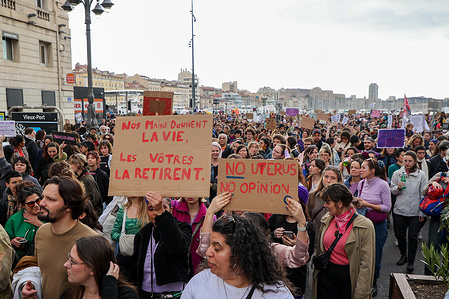 Protesters hold placards during the demonstration on Women's Day protesting against women's inequality and sexual violence. On International Women's Day, feminist organizations and civil society groups organized a march on the streets of Marseille.