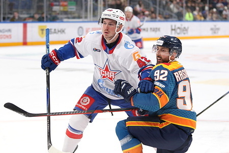 Kirill Rasskazov (92) of Shanghai Dragons, and Mikhail Vorobyov (42) of SKA Hockey Club seen in action during the Hockey match, Kontinental Hockey League 2025/2026 between Shanghai Dragons China and SKA Saint Petersburg at the SKA Arena. (Final score; Shanghai Dragons 2:3 SKA Saint Petersburg).