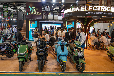 A view of the stall of Garuda Electric Mobility Pvt. Ltd, an Indian electric scooter manufacturer, showcasing its Electric scooter models during the 7th edition of RideAsia-EV. The 7th edition of RideAsia-EV is being held from April 24 to 26, 2026, at Bharat Mandapam in New Delhi. The event brings together key players in India’s electric vehicle industry, including manufacturers of e-scooters, e-bikes, and e-rickshaws, as well as suppliers of components, batteries, and charging technologies.