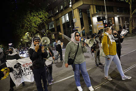 A protester shouts slogans during the rally. A snap rally was held in Melbourne by pro-trans activist groups calling for the abolition of police and Border Force. The demonstration condemned the use of force by Victoria Police against protesters and marginalized communities particularly in the context of anti-colonial and working-class resistance. Organizers accused the state of using law enforcement to suppress dissent and uphold systemic oppression. The rally showed solidarity among trans activists demanding justice and safety. The protest reflects growing calls for transformative justice and systemic change within Australia’s policing and border control systems.