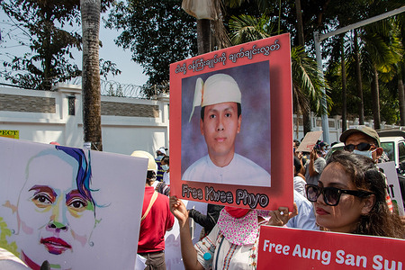 Protesters hold placards and portraits during the military coup demonstration.Protesters took to the streets of Yangon to protest against the military coup and demanded the release of Aung San Suu Kyi.Myanmar's military detained State Counsellor of Myanmar Aung San Suu Kyi on February 01, 2021 and declared a state of emergency while seizing the power in the country for a year after losing the election against the National League for Democracy (NLD).