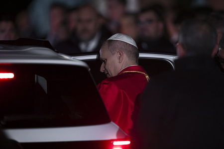 Pope Leo XIV leaves at the end of the Good Friday Way of the Cross at the Colosseum.