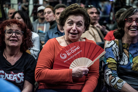 An older woman holds a fan with the Barcelona en Comu logo, waiting for the result of the municipal elections in Barcelona.
In the old 'Fabra i Coats' factory the militants and party members from Ada Colau have met to watch the election result where the mayor (Ada Colau) has been defeated by 5000 votes by his rival Ernest Maragall from the party ERC (Esquerra Republicana de Catalunya), but with the same number of seats (10).